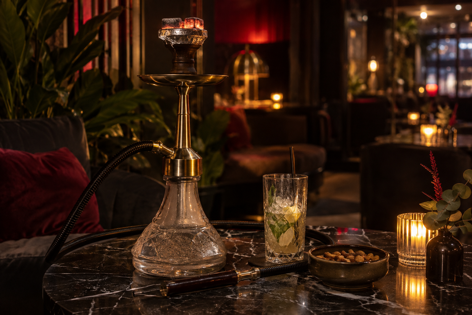 Classic shisha on black marble with a cocktail in a warm lounge